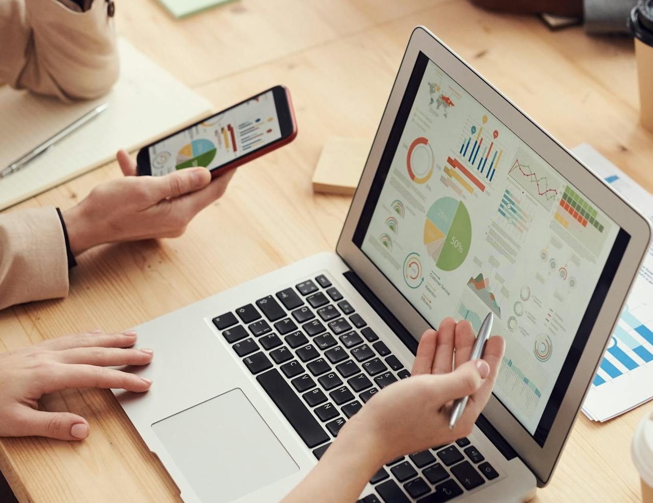 A multicultural team discussing analytics and strategy in a modern office setting.